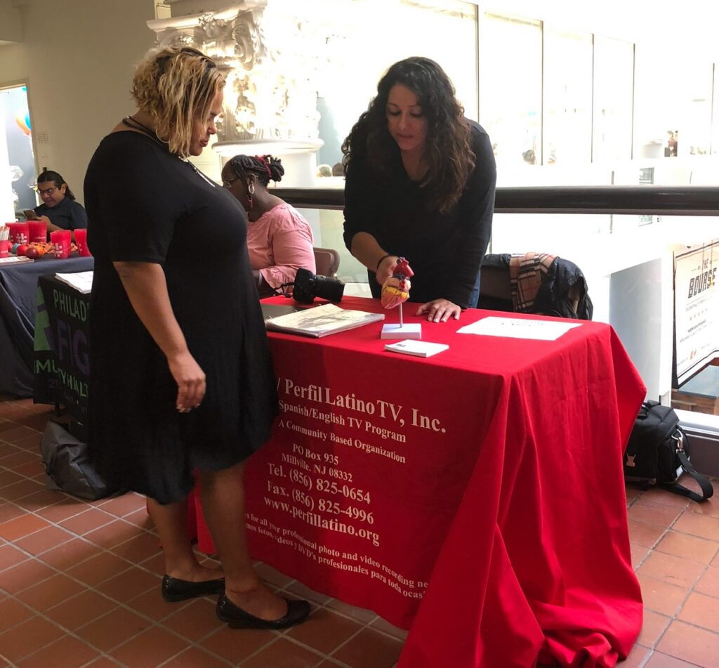 Two women discussing literature at a table