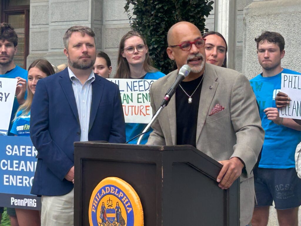 Chris Rabb speaking at an outdoor rally