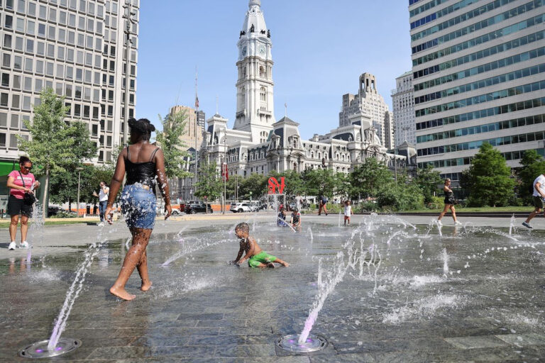 Children cooling off in a public fountain in LOVE Park