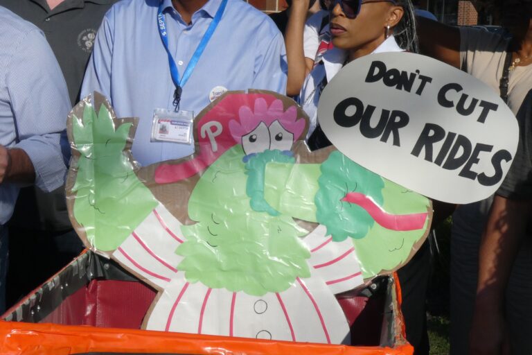 a sign of the phillie phanatic reads DON'T CUT OUR RIDES
