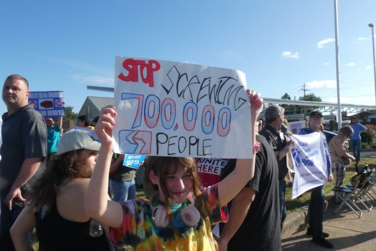 a sign with the SEPTA logo reads STOP SCREWING 700,000 PEOPLE