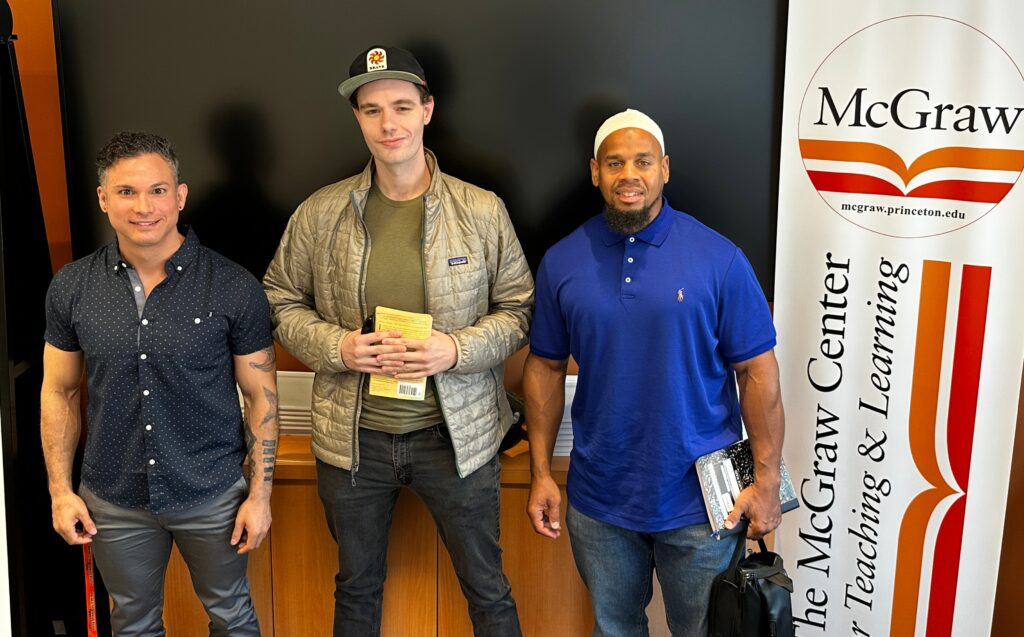 princeton-prison-teaching-iniative-2025 Three people in Princeton University's Prison Teaching Initiative smile
