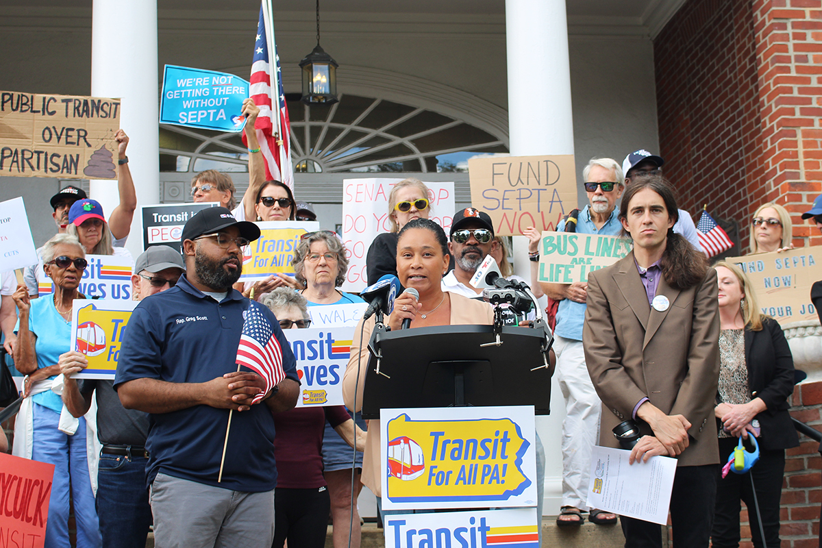 Jamila Winder speaks in front of SEPTA funding rallygoers
