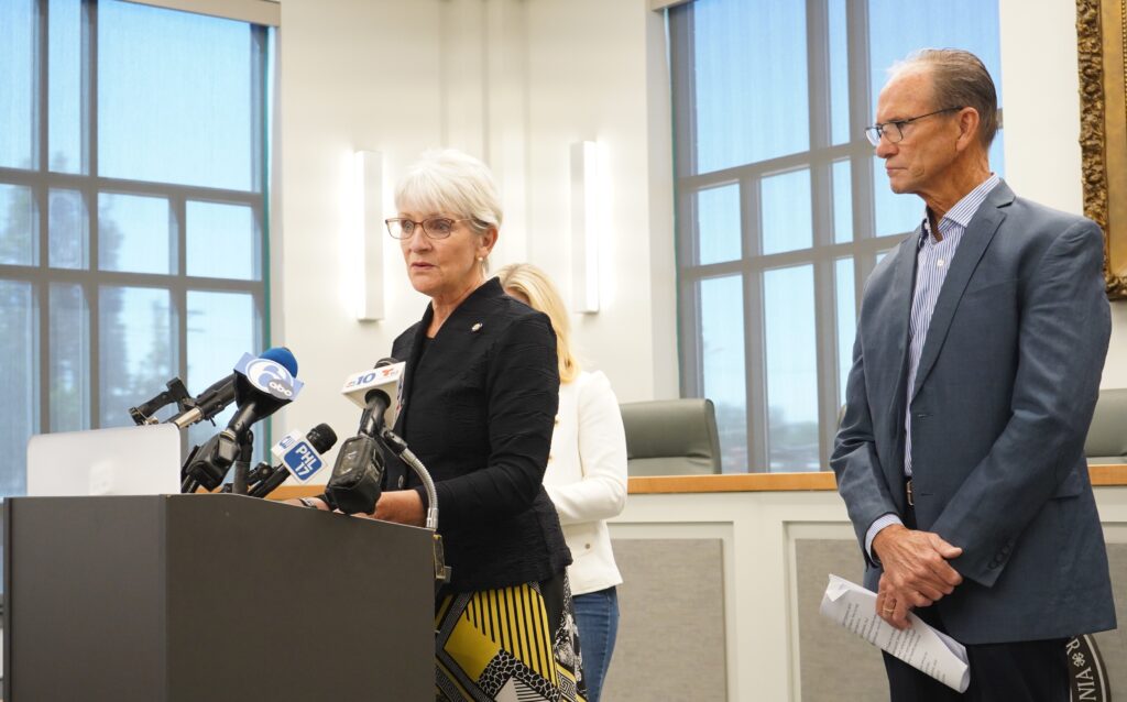Carolyn Comitta speaks at a podium