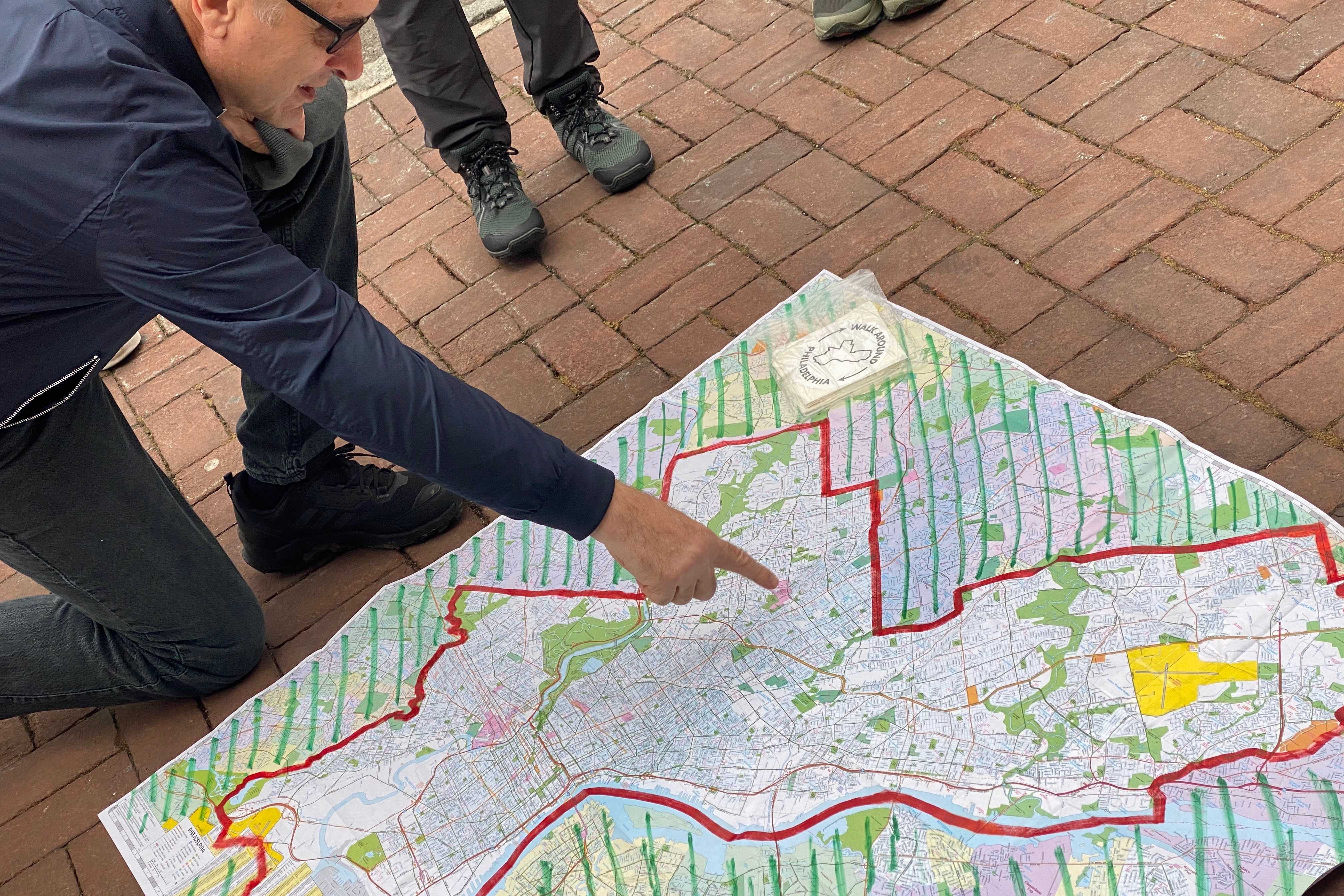 Walk Around Philadelphia participants look at a map on the ground