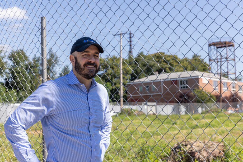 08 29 2025 k paynter sepviva lofts harrowgate philadelphia housing north-3 Philip Balderston posing for a photo near the lot that will be developed