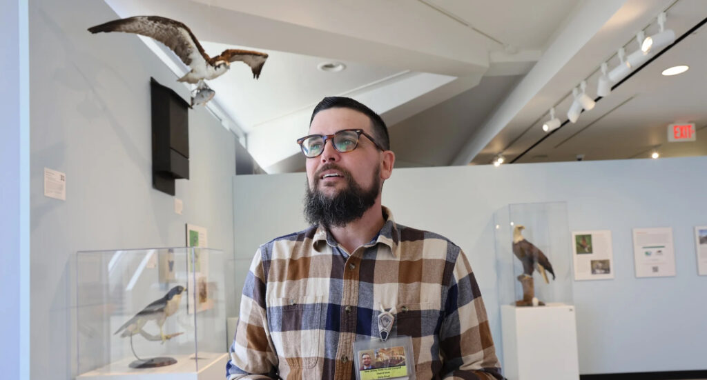 2025-04-17-e-lee-dana-erhet-trenton-nj-state-museum-curator copy Dana Erhet posing for a photo inside the museum