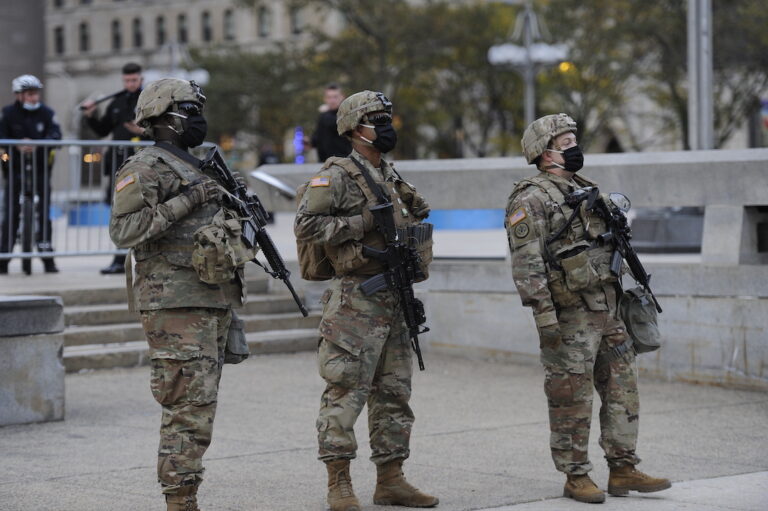 President Trump has threatened to send federal troops to crime-ridden cities. Could Philadelphia be next? Here, a photo of the Pennsylvania National Guard stand watch near City Hall in 2020. (AP Photo/Michael Perez)