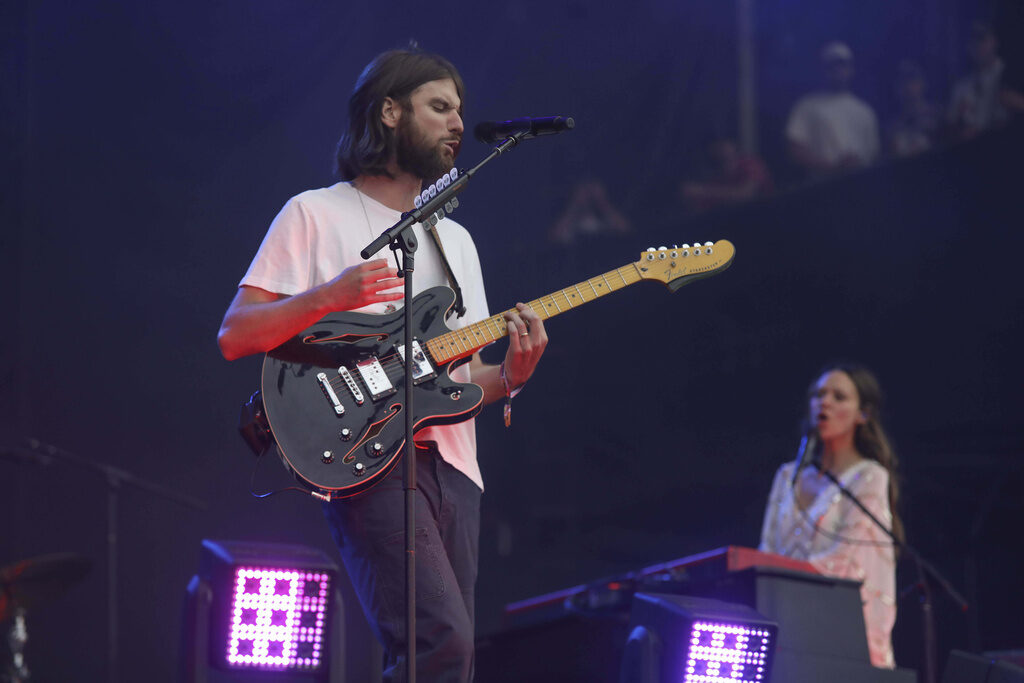 Matt Quinn, left, and Jackie Miclau from the band Mt. Joy perform on stage