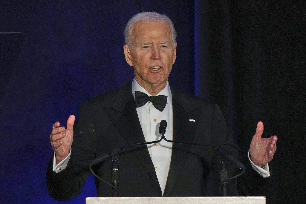 Biden Skin Cancer Former President Joe Biden speaks at a podium
