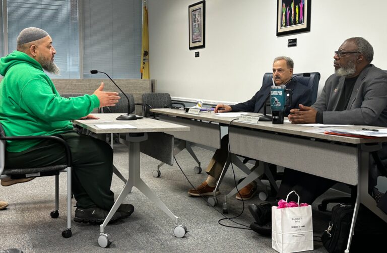 Faheem Lea addressing State Board of Education member Jack Fornaro and Board Vice President Nedd James Johnson with his concerns about the Camden City School District during public testimony
