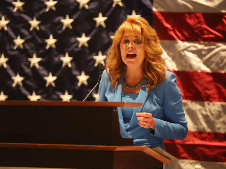 State treasurer Stacy Garrity speaks at the Pennsylvania Republican Party’s fall meeting with an American flag behind her