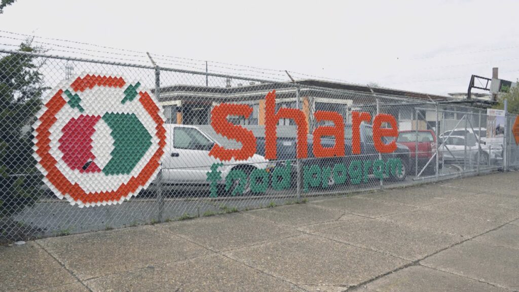 YOK_EVERGREEN CHARITIES 7_2024 #516_frame_1576 Share food logo program on fence