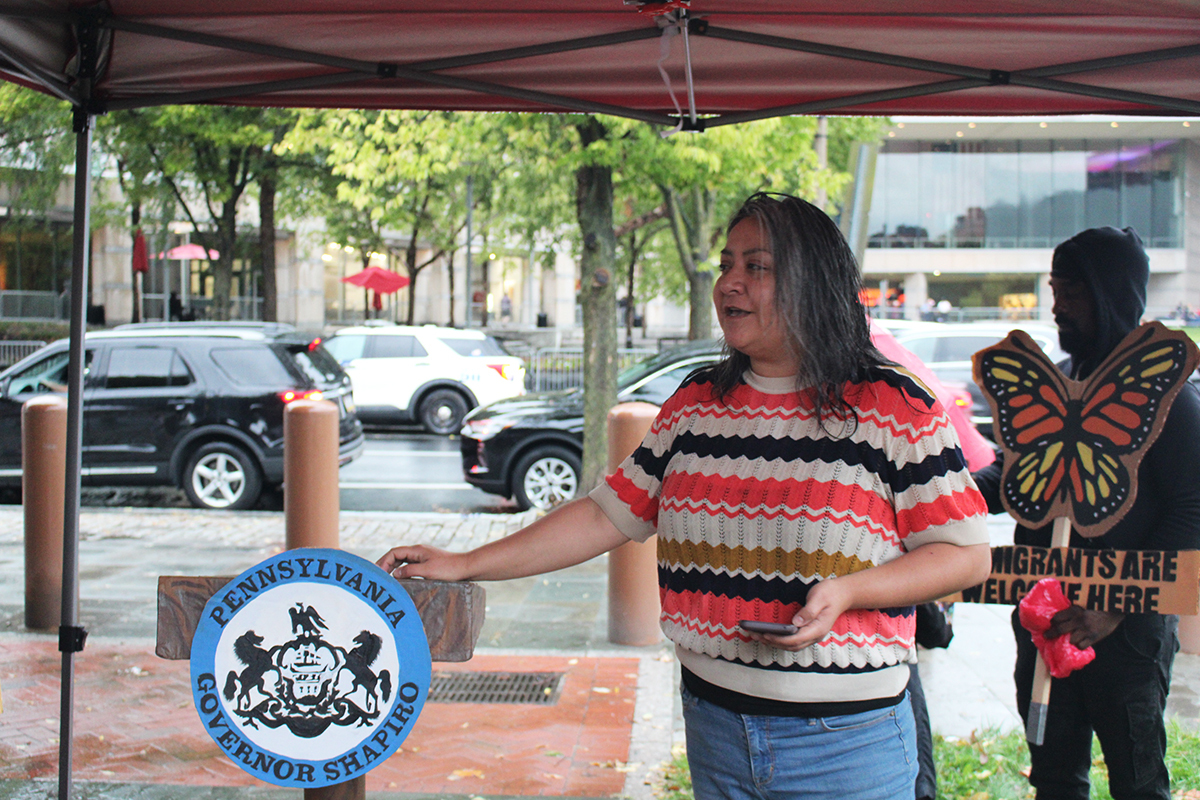 Jasmine Rivera speaking at an ICE protest