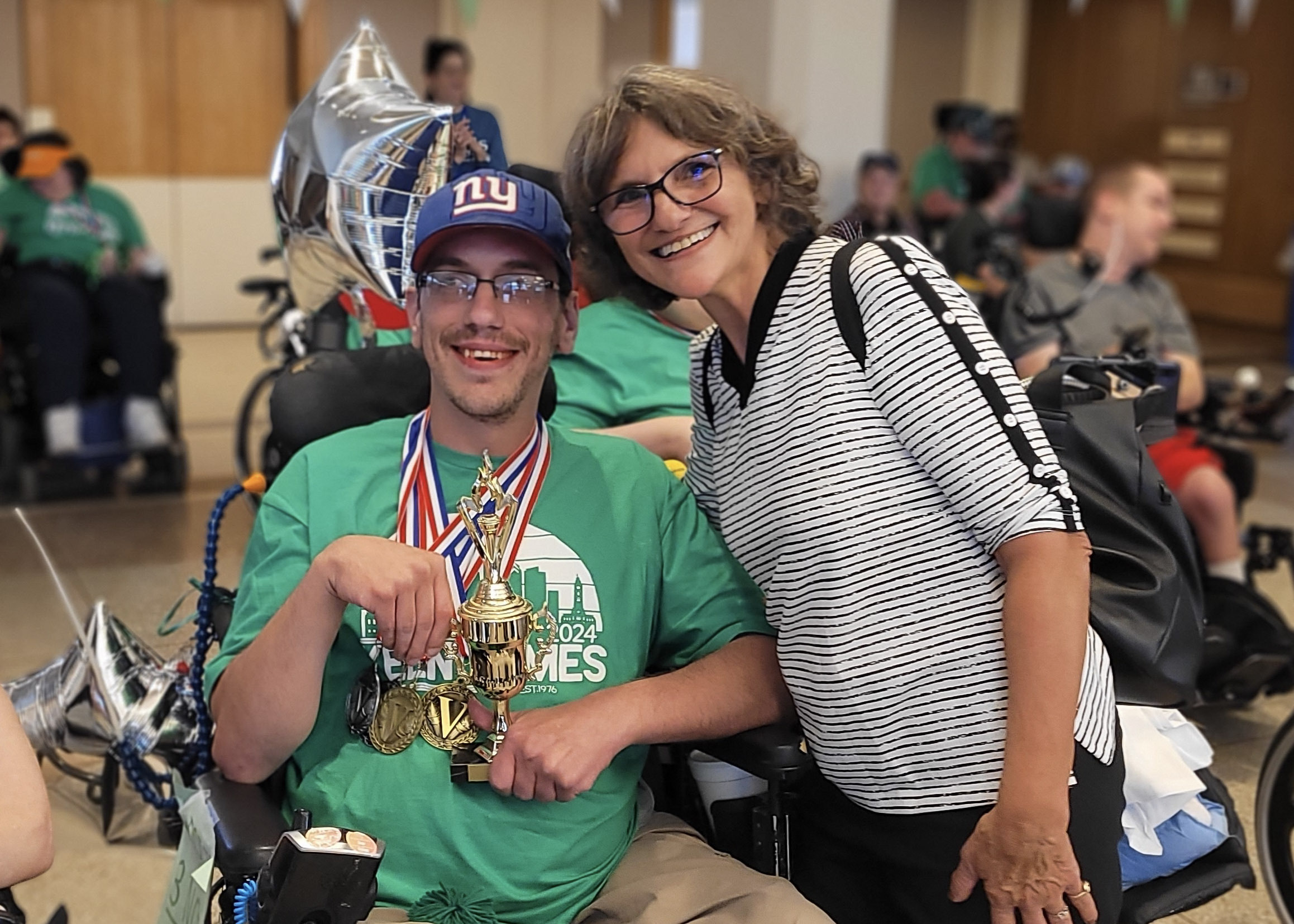 Aaron Deede and his mother, Ann Phillips, smile