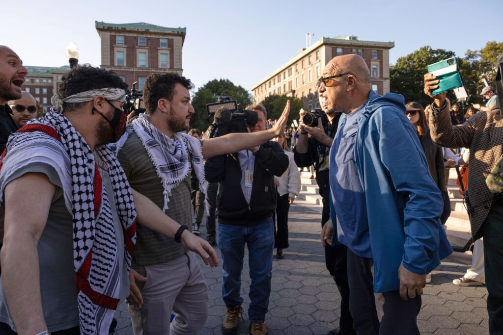 Mahmoud Khalil debates with a pro-Israel demonstrator