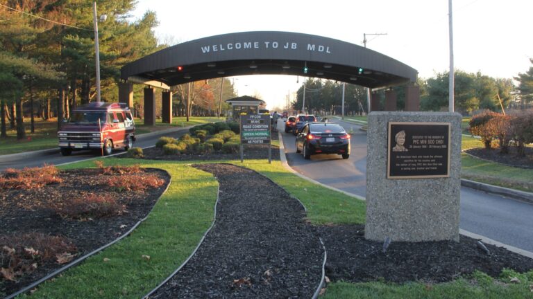 A sign at the entrance of the base welcomes people driving in.