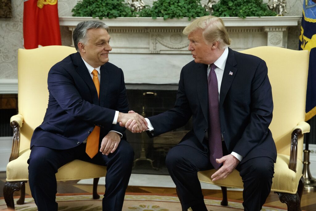 Trump Orban Media Donald Trump and Viktor Orbán shaking hands while sitting next to each other