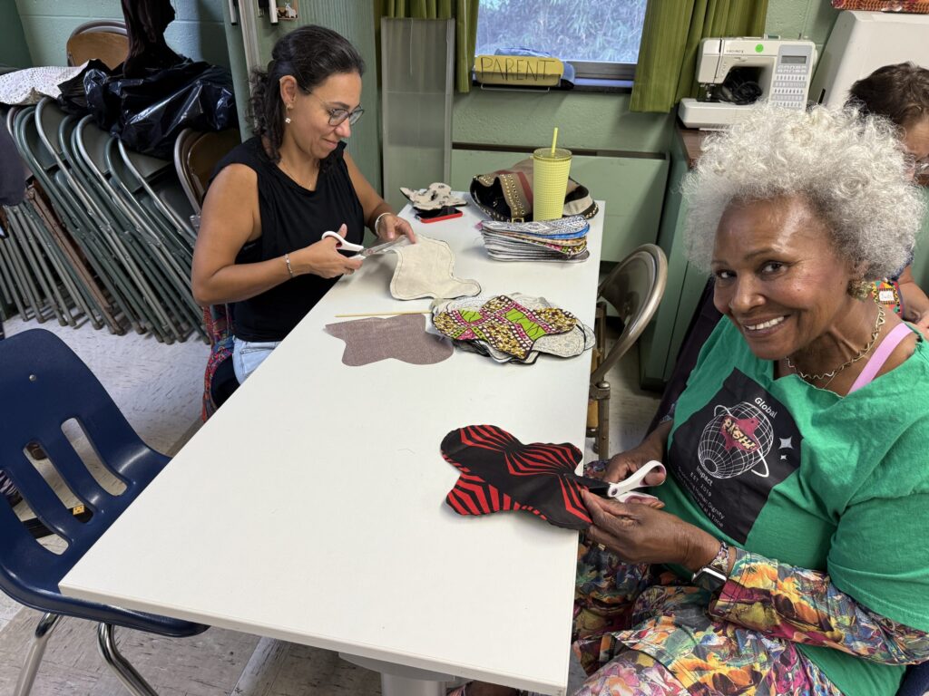 Volunteers with different skills sit at tables
