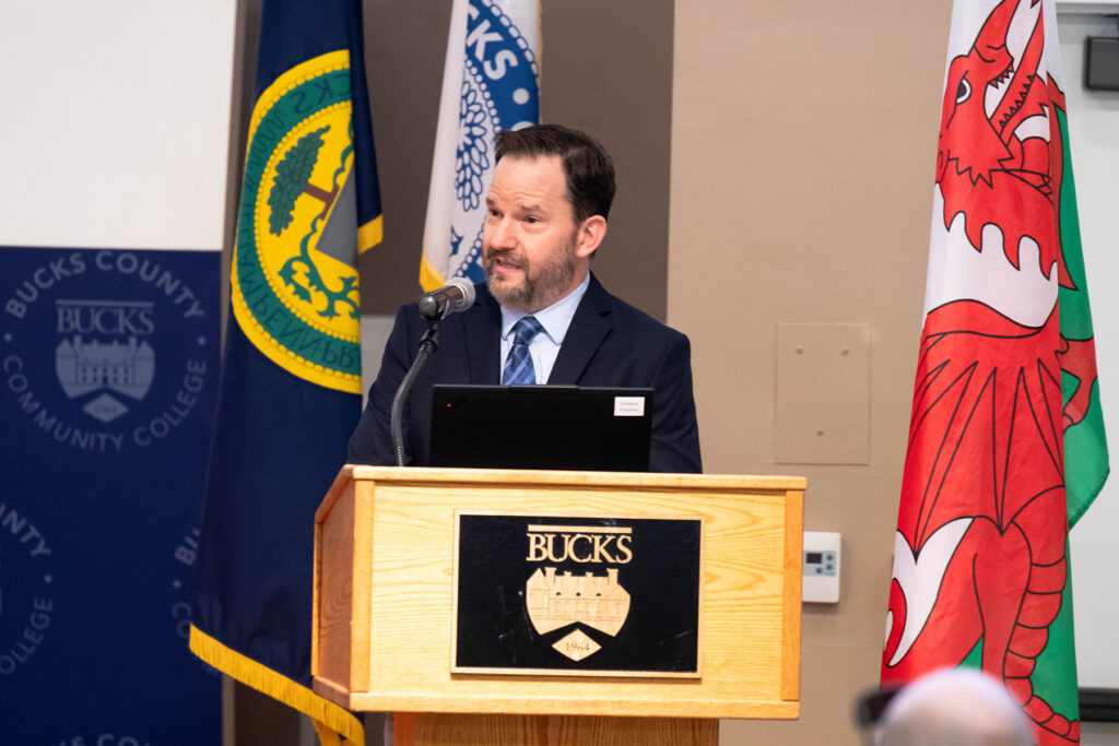 Greg Luce, dean of the School of Business, Innovation and Legal Studies at Bucks County Community College, speaks at a podium