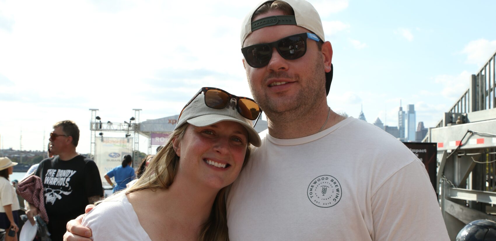 Julie and Chris Dinsmore smile at XPoNential Music Festival