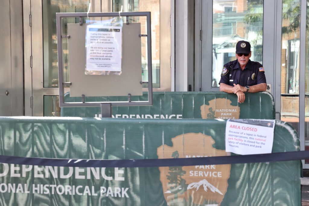 A private security guard stands at the entrance to the Liberty Bell Center, which has been closed to the public since the shutdown of the federal government on Oct. 1.