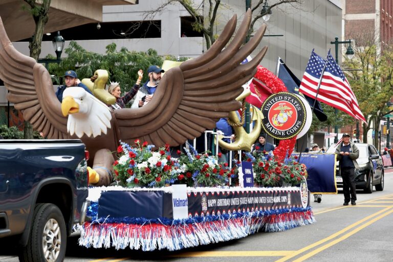 Miss Pennsylvania waves from the Marine Corps float