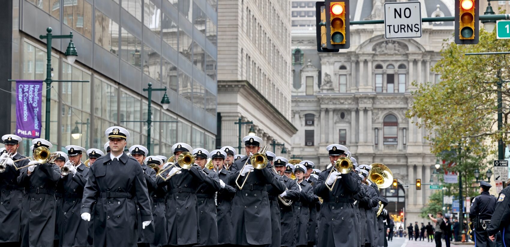 The United States Navy Band marches down Market Street