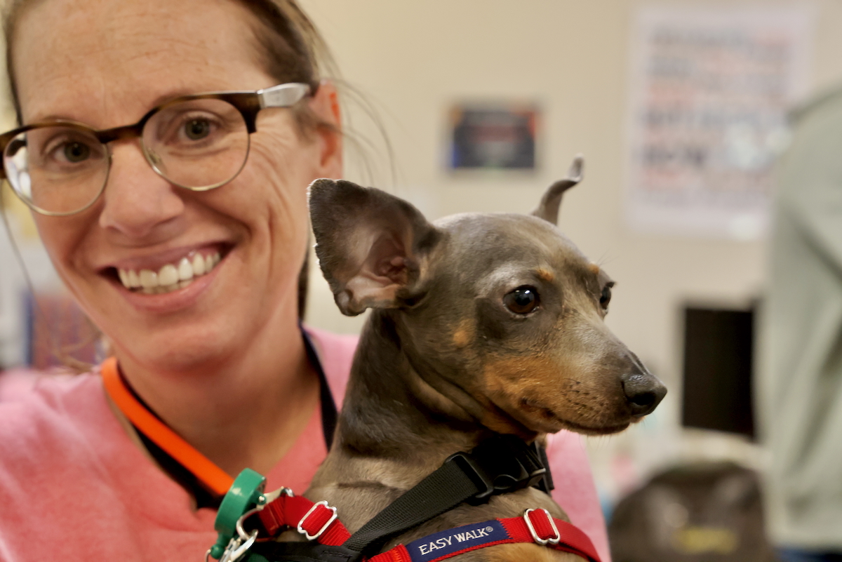 Allison Hussey and a String Theory School therapy dog