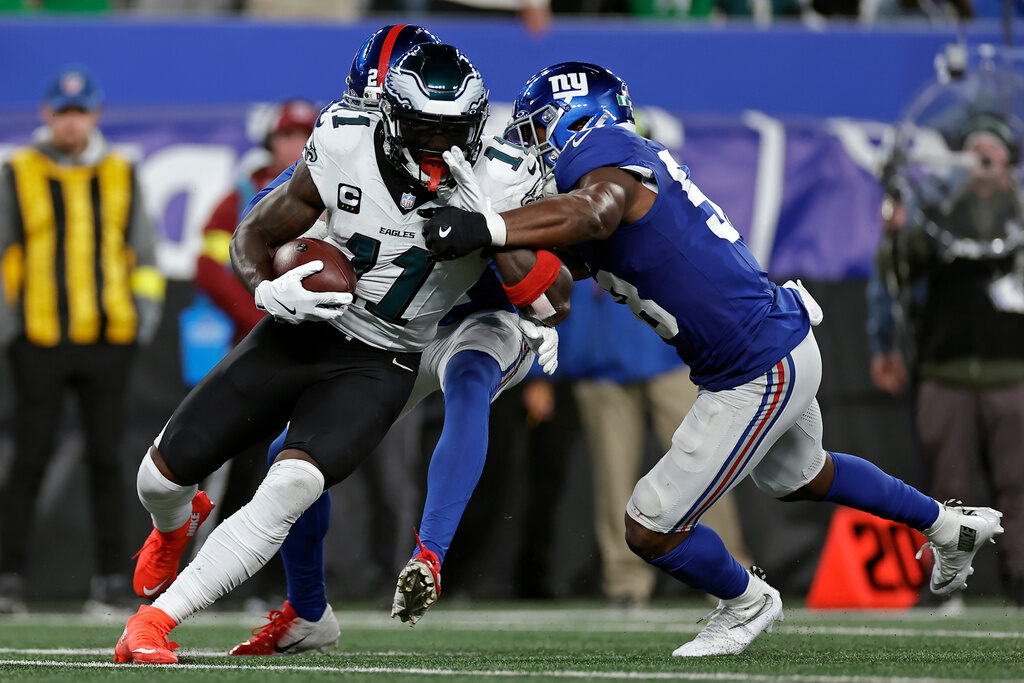 Philadelphia Eagles wide receiver A.J. Brown (11) is tackled by New York Giants inside linebacker Bobby Okereke (58) during the second half of an NFL football game
