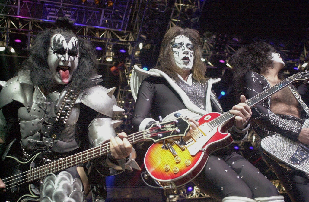 Obit Ace Frehley Kiss guitarist Paul Stanley, right, guitarist Ace Frehley, center, and bassist Gene Simmons play during the band's farewell concert