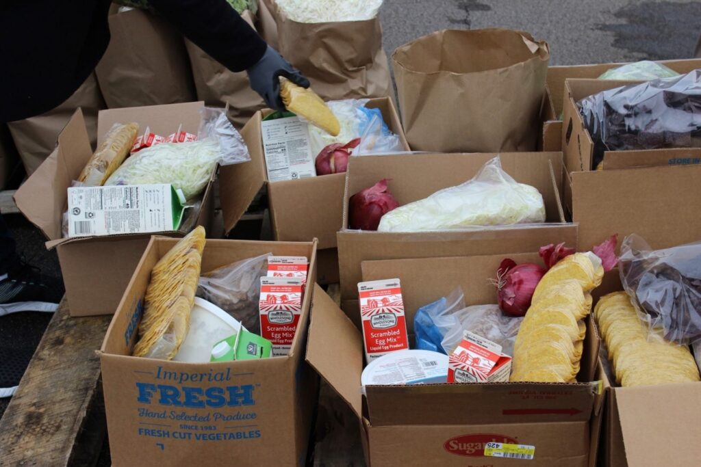 Food-bank-distribution-Pittsburgh-wesa Food sitting in boxes at a distribution center