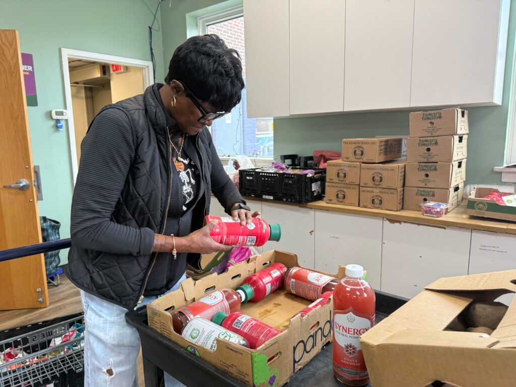 Starlene Martin goes through bottles at the Lutheran Settlement House in Philadelphia