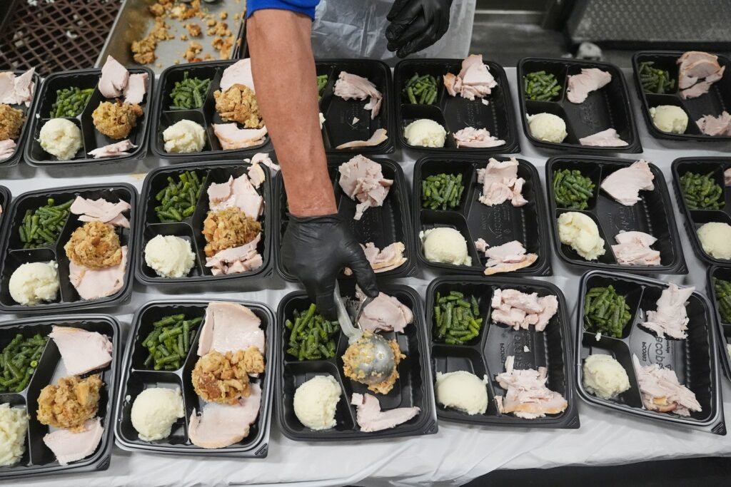 APTOPIX US Government Shutdown-SNAP A volunteer prepares meals at the Philabundance Community Kitchen in Philadelphia, Thursday, Oct. 30, 2025.