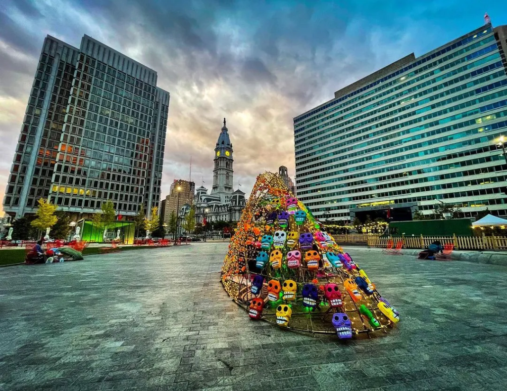 dayofdead A colorful sculpture with skulls in LOVE Park