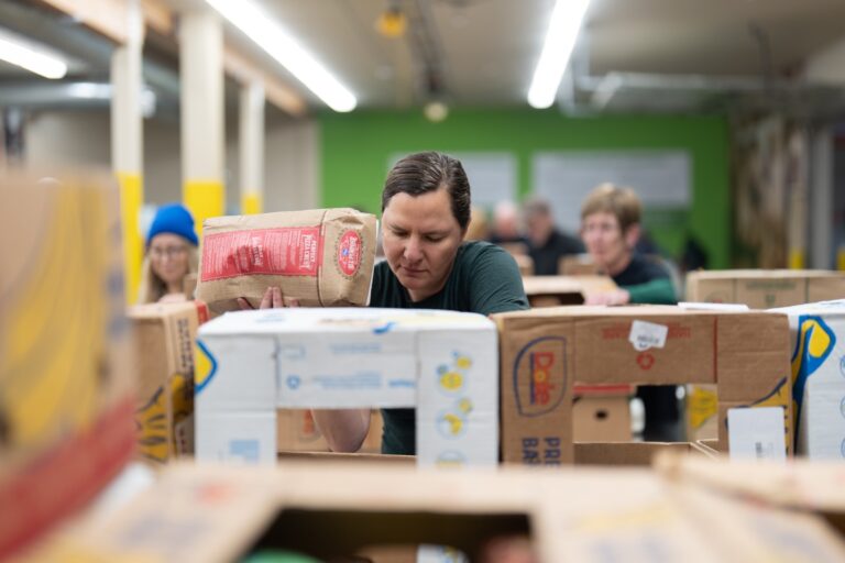 People working sorting food at a food bank