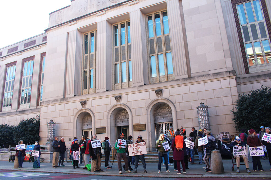Dozens of people gather outside of Sen. John Fetterman's Old City office, holding signs calling for an end to the War in Gaza