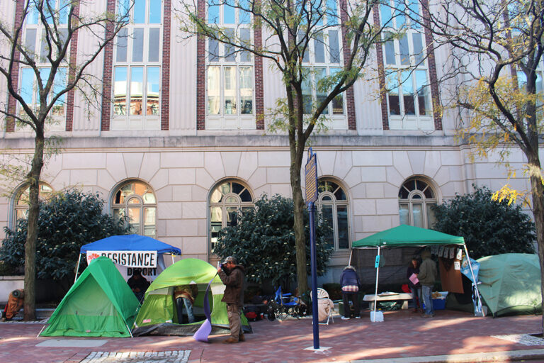 People camp in tents outside of Sen. John Fetterman's Old City office