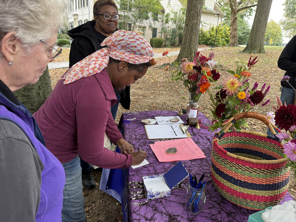 Attendees of the "grief processional" fill out cards that represent what they are grieving