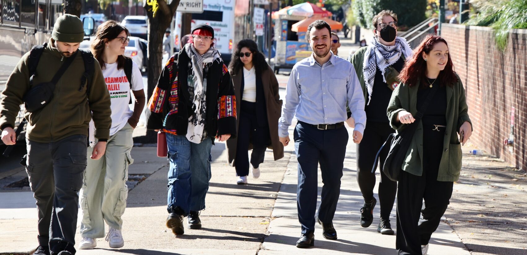 Mahmoud Khalil walks with supporters on 6th Street