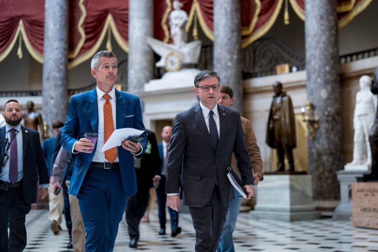 Sean Duffy walks with Mike Johnson