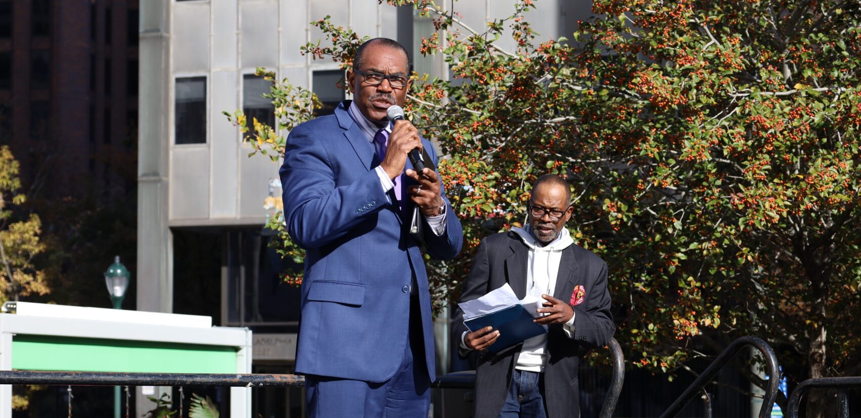 Former NAACP Philadelphia President Rodney Muhammad speaks into a mic