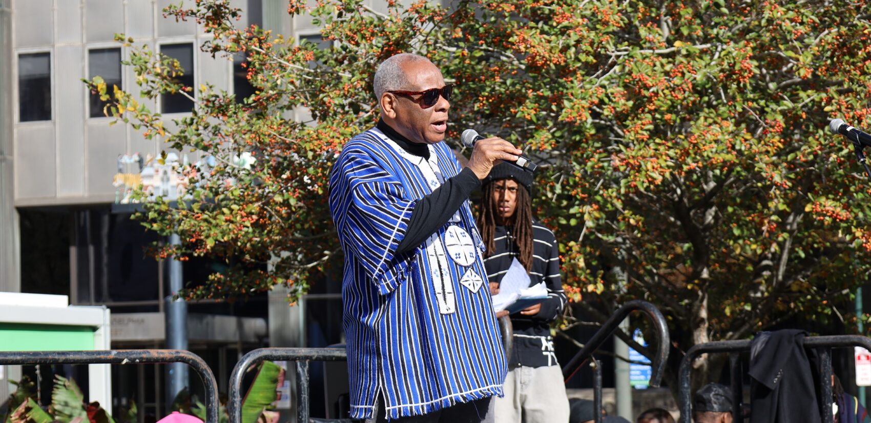 Temple University professor and author Molefi Asante speaks into a mic