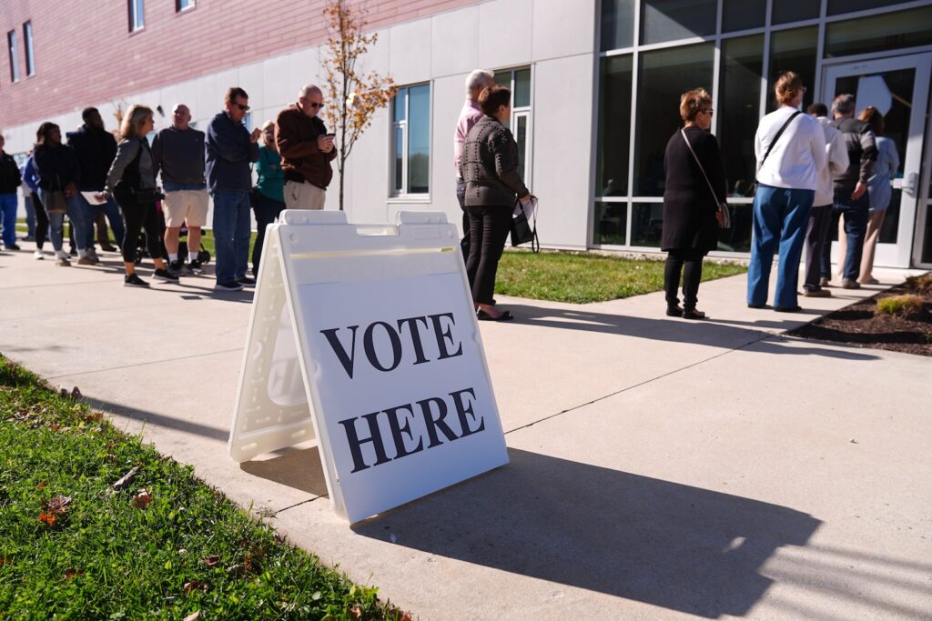 Voters wait in line to cast their ballots at a polling place at Rowan College in Mount Laurel, N.J., Monday, Oct. 27, 2025.