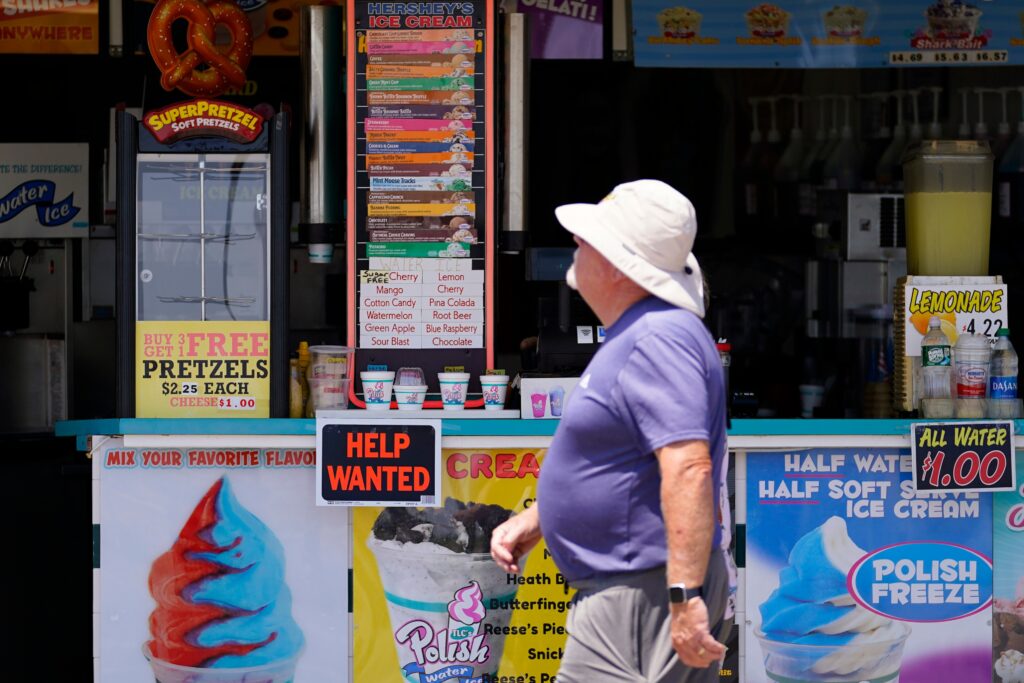 A person walks on Ocean City's boardwalk
