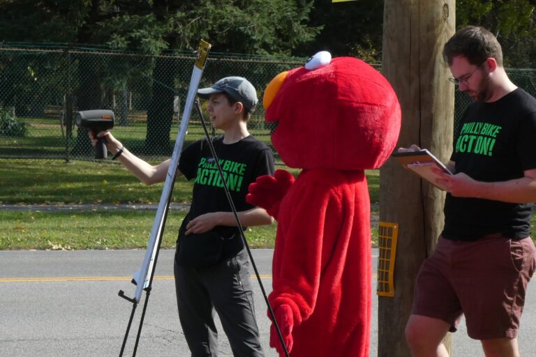 Elmo and two Philly Bike Action participants