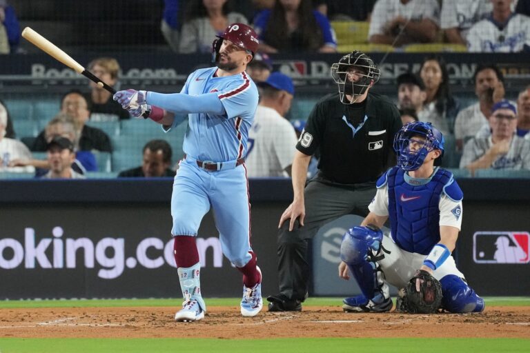 Philadelphia Phillies' Kyle Schwarber follows his solo home run off Los Angeles Dodgers starting pitcher Yoshinobu Yamamoto during the fourth inning in Game 3 of baseball's National League Division Series Wednesday, Oct. 8, 2025, in Los Angeles.