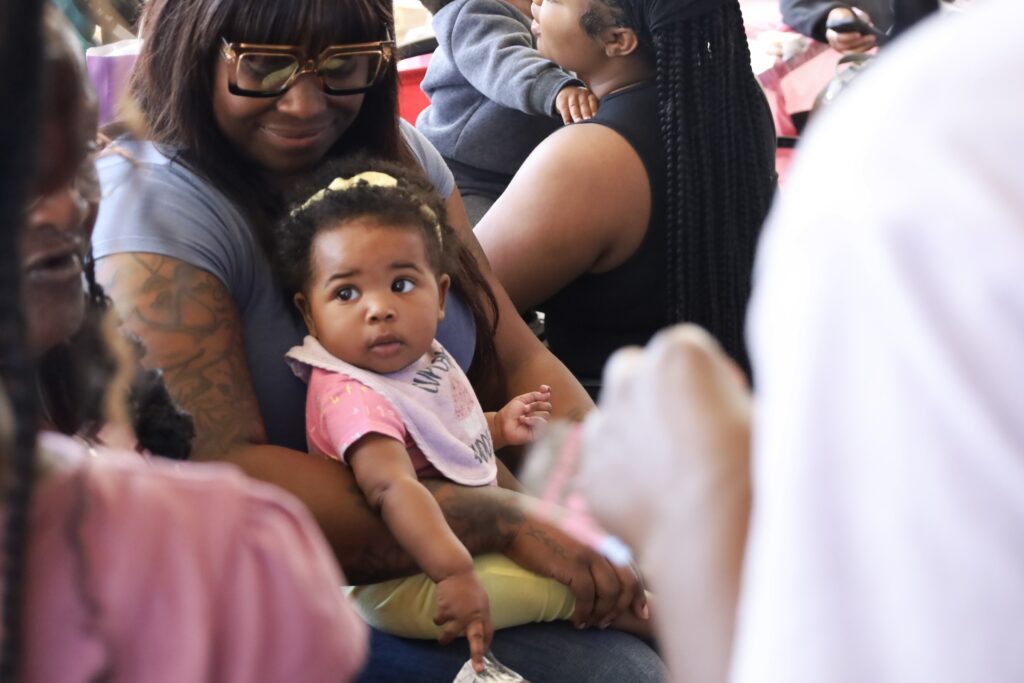 philly-joy-bank-n-leonard-2025-10-06-1 A woman holding a baby