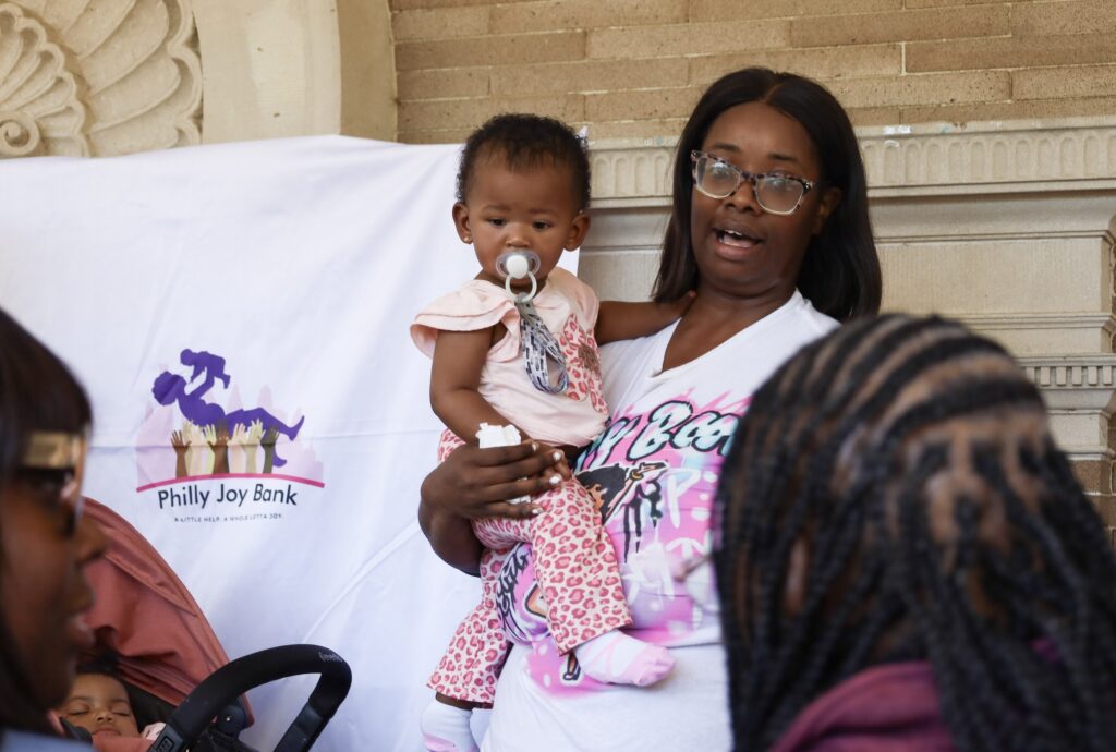 A woman holding a baby