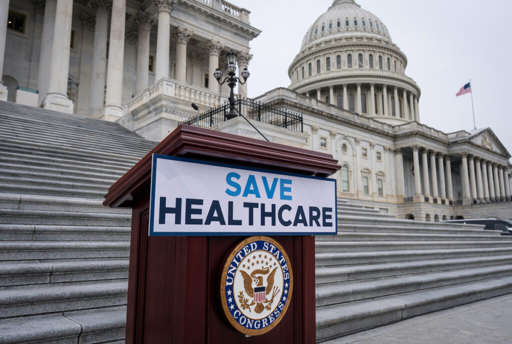 Congress Shutdown Save Healthcare sign outside U.S. Capitol